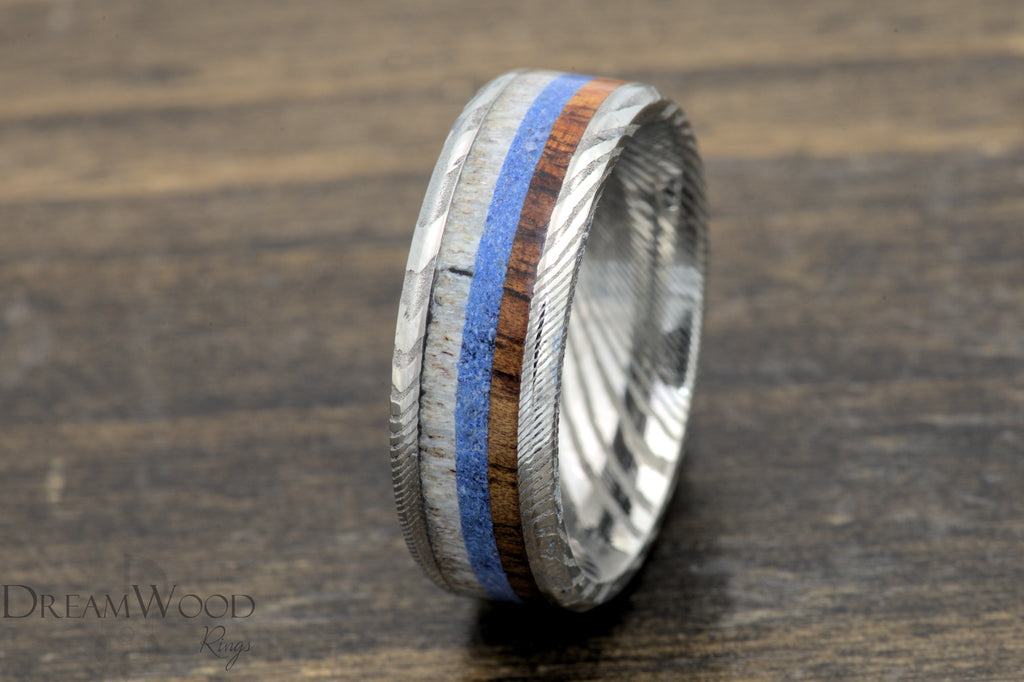 The Majestic Voyage - Damascus Steel Ring with Koa Wood, Lapis, and Antler Inlay - DreamWood Custom